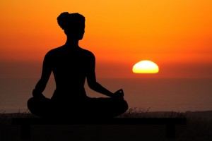 yoga meditation pose at sunset